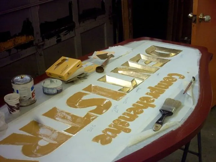 Applying the Gold Leaf to Carved Sign — How It’s Made by Hale Custom Signs